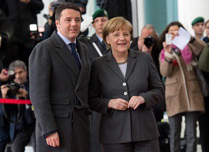 epa04130227 Italian Prime Minister Matteo Renzi (L) poses for the media as he is welcomed with military honors by German Chancellor Angela Merkel (R) during his inaugural official visit in Berlin, Germany, 17 March 2014. Merkel and new Italian Prime Minister Matteo Renzi along with members of their respective cabinets held talks in Berlin after Merkel greeted her Italian guest with military honours at the chancellery. EPA/Bernd Von Jutrczenka